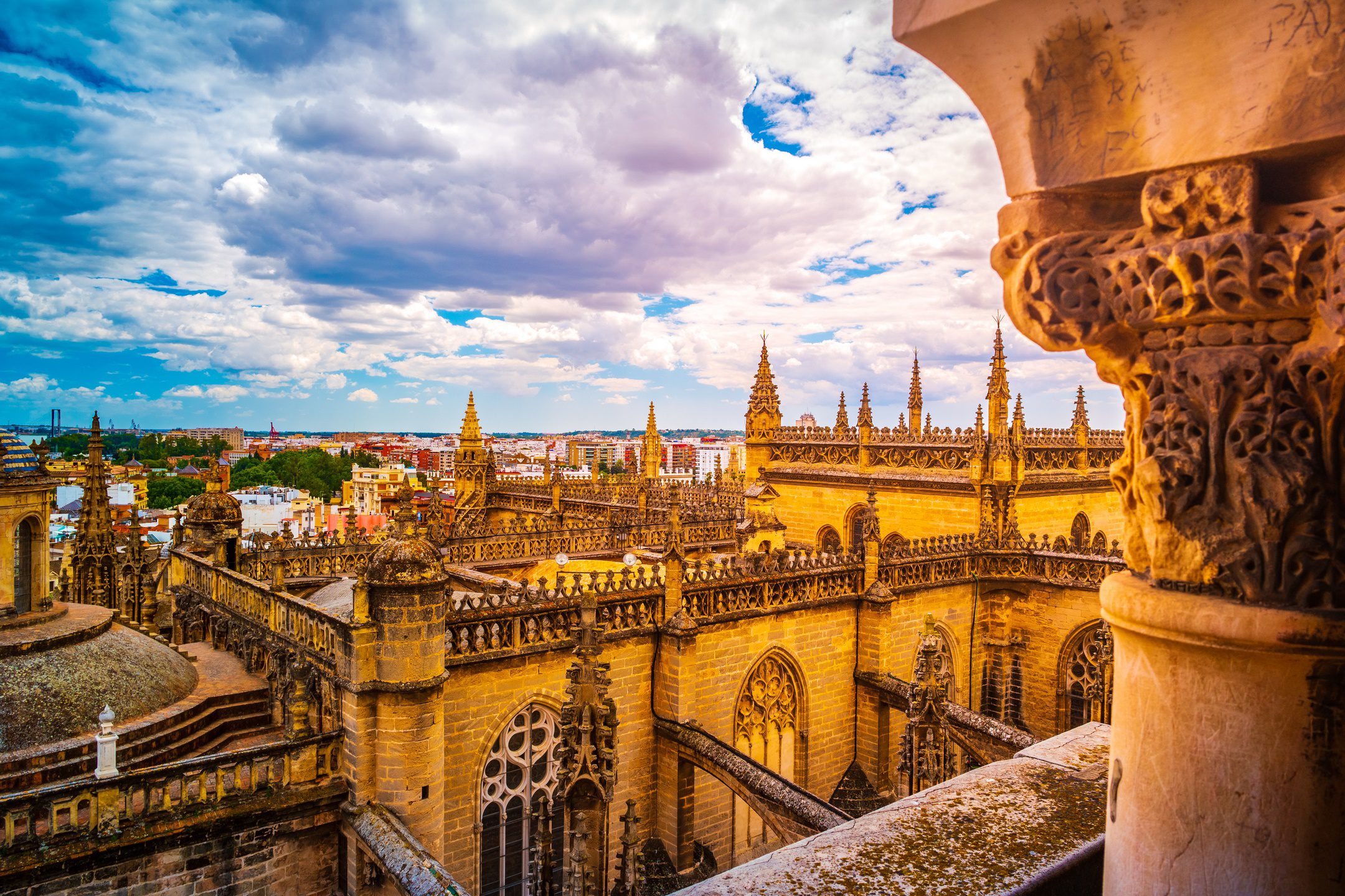 Spain Tours for Seniors / Aerial view of Seville city and Cathedral of Saint Mary of the See in Seville, Andalusia, Spain, Europe