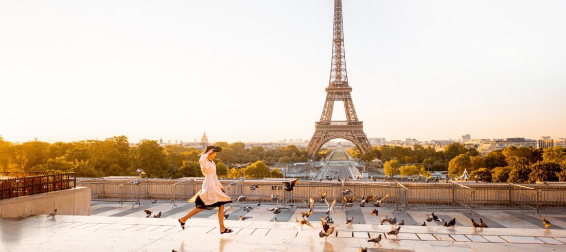Woman on the square with beautiful view on the Eiffel tower in Paris
